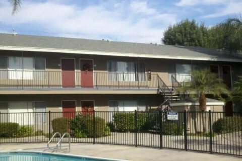 exterior of Flanders Pointe showing partial swimming pool