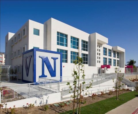 entrance of Villa Nueva Apartments with large V N sign